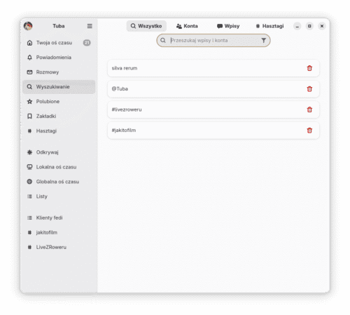 Zakładka wyszukiwania w Tubie z zapisanymi czterema ostatnimi zapytaniami: silva rerum, @Tuba, #livezroweru, #jakitofilm. Po prawej stronie każdego zapytania znajduje się czerwona ikonka kubła na śmieci pozwalająca na skasowanie go.